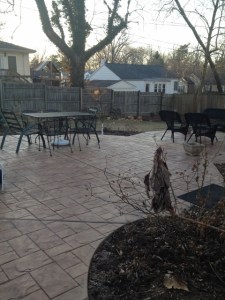 Today, a stamped concrete patio provides plenty of room for entertaining, relaxing and enjoying the garden