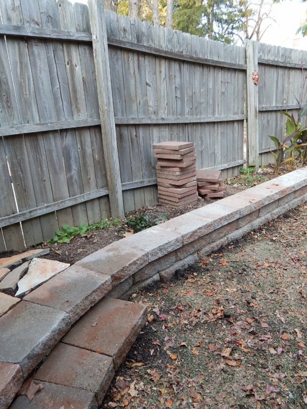 The lower left is the step added to the wall at the entrance to the yard. I do like the curve. 